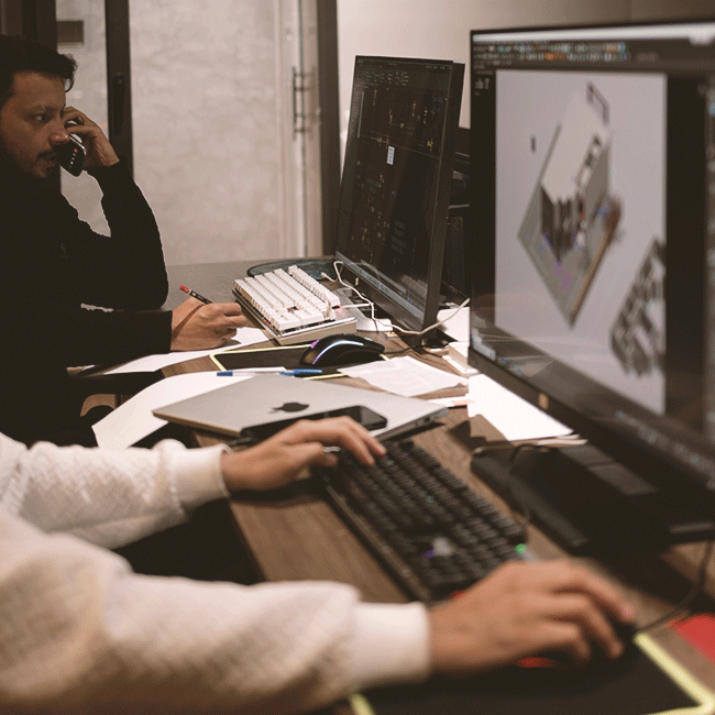 Modern architectural studio of DBL Design Build Live in Islamabad with building plans and 3D models